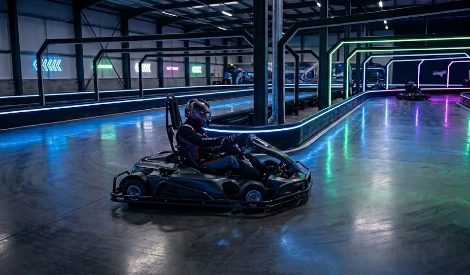 Electric karts racing on a tight indoor track